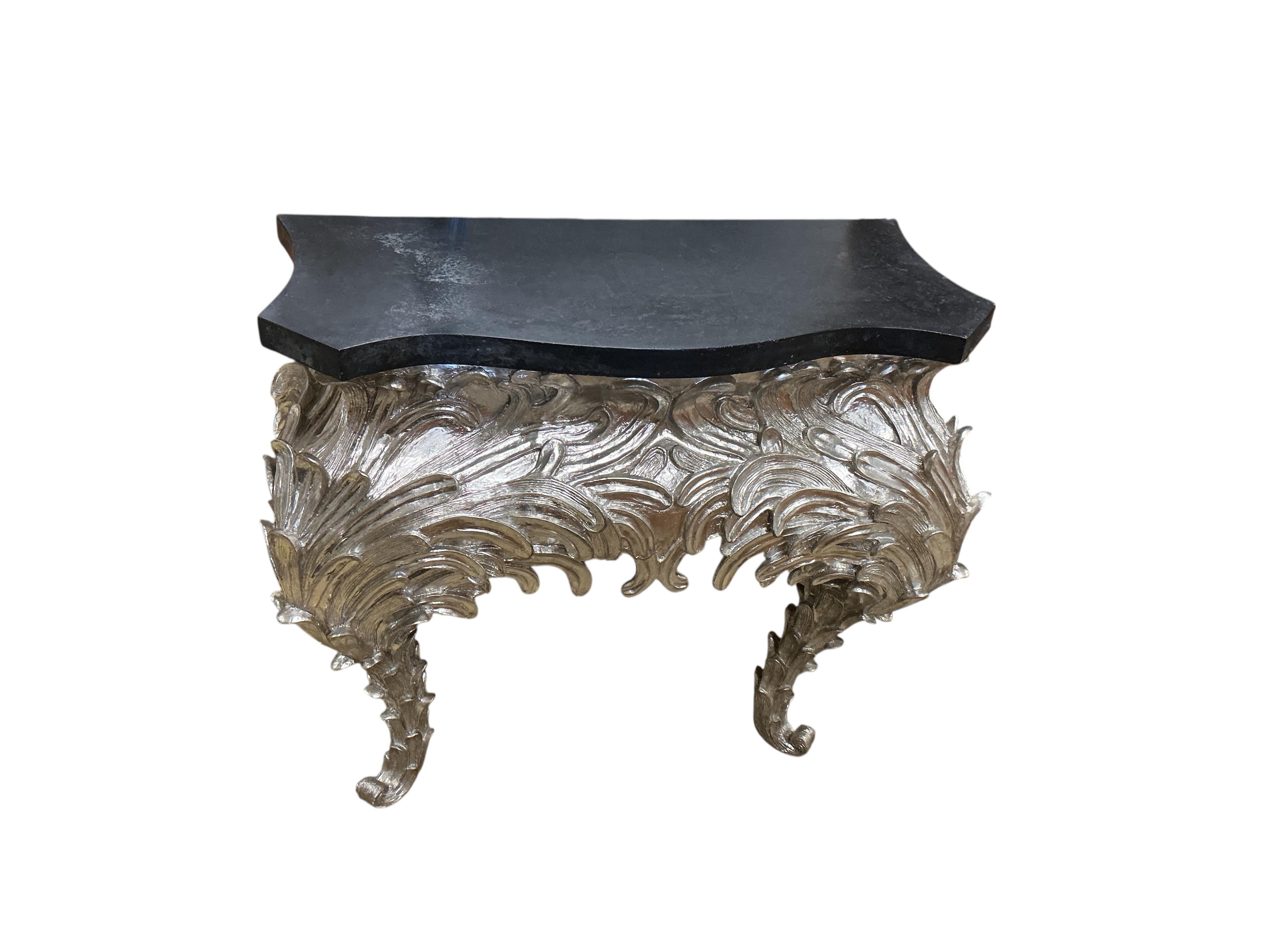 A pair of contemporary silvered composition serpentine 